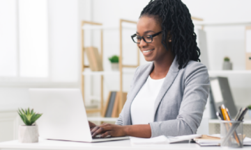 Person at desk giving a webinar presentation.