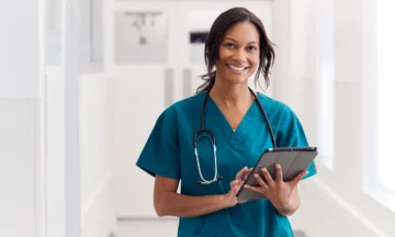 Nurse accessing digital resources on a tablet