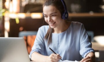 woman taking notes