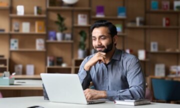 Man Thinking on laptop