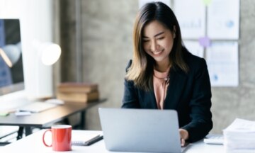 Woman looking at work laptop