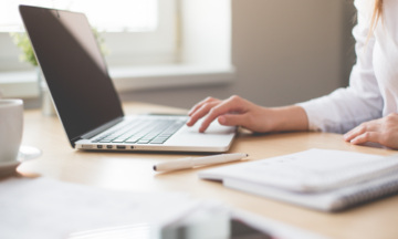 Woman works at a laptop